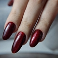 Dark red cat eye manicure
