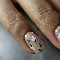 Floral nail design in nude tones