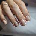 Gentle nude manicure with flowers