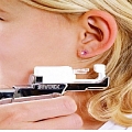 Ear piercing by STUDEX 75 system