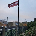 Latvian flag in the yard of a private house